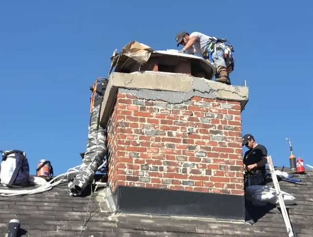 Hudson Chimney Sweep installing a custom chimney crown in Hudson, OH
