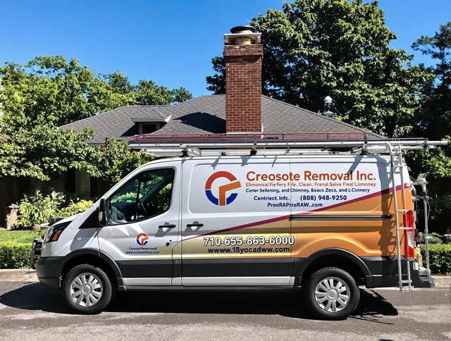 Hudson Chimney Sweep technician removing creosote safely in Hudson, OH