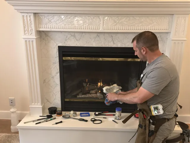 Hudson Chimney Sweep performing fireplace maintenance in Hudson, OH