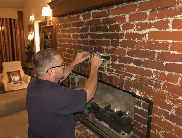 Hudson Chimney Sweep expert fixing a fireplace in Hudson, OH